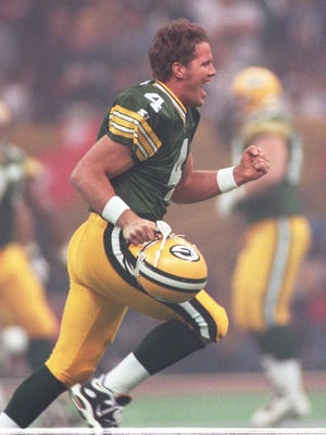 Brett Favre celebrates a touchdown pass to Antonio Freeman in Super Bowl XXXI.