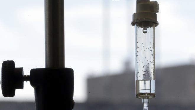 Chemotherapy is administered to a cancer patient via intravenous drip in Durham, N.C. In a study sponsored by the National Cancer Institute.