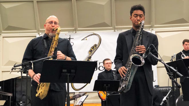 Anthony Bolden, a junior saxophone player at West Salem High School, on stage with Saxophonist Jeff Coffin at the West Salem Jazz Festival on Saturday, Feb. 10.