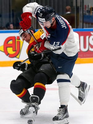 Constantin Braun of Germany plays against Tomas Jurco, right, of Slovakia during the hockey world championships in St. Petersburg, Russia, on May 10, 2016.