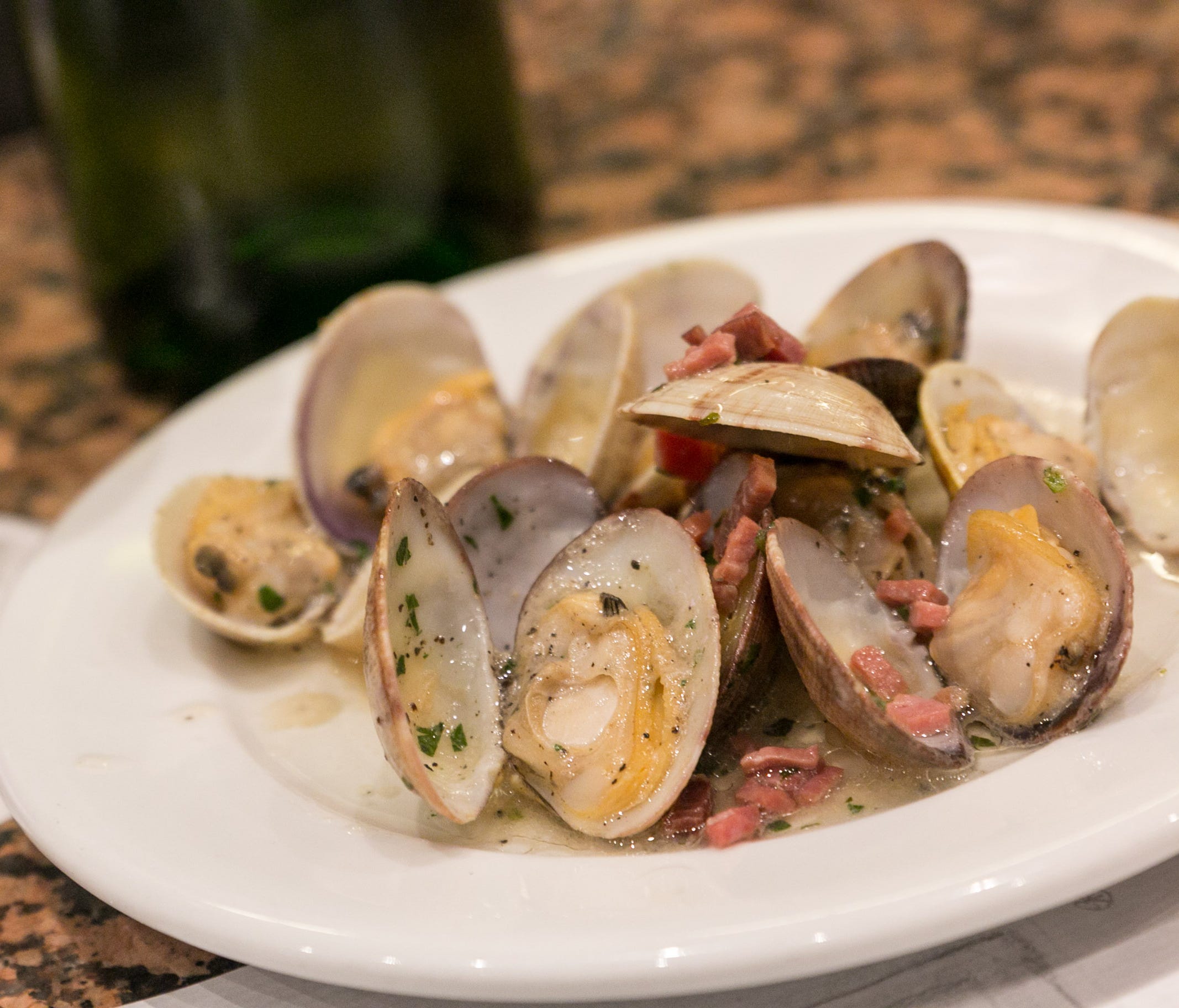 The clams, big and small, are garlicky delicious, as are the squid a la plancha.
