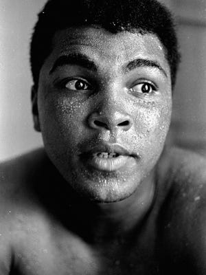 FILE - In this May 25, 1965 file photo, perspiration beads on the face of world heavyweight boxing champion Muhammad Ali during training for his fight with Sonny Liston, in Lewiston, Maine. Ali, the magnificent heavyweight champion whose fast fists and irrepressible personality transcended sports and captivated the world, died on Friday, June 3, 2016, according to a statement released by his family. He was 74. (AP Photo/File)