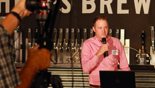Ryan Theel, of the Ignite Sheboygan committee, presents at a recent Ignite event at 3 Sheeps Taproom in Sheboygan.