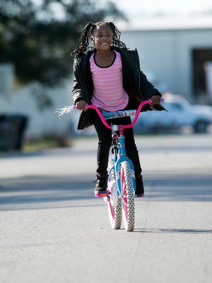 Tairra Walker plays after school in a Southwest Pensacola neighborhood in this file photo.