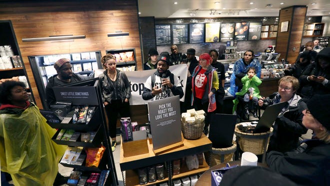 Demonstrators occupy the Starbucks that has become the center of protests Monday, April 16, 2018, in Philadelphia. 