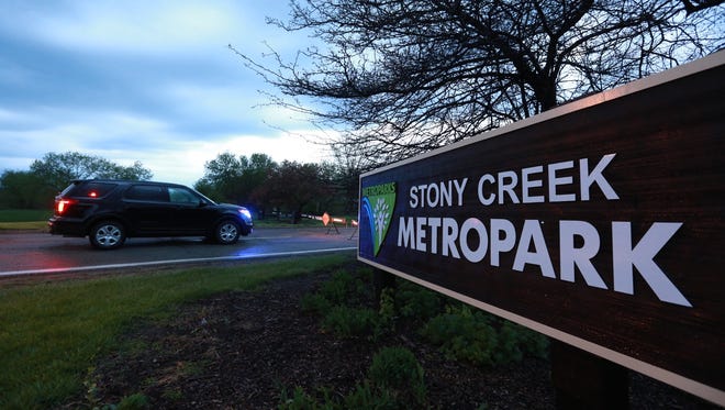 Police vehicle blocks the entrance to Stony Creek Metropark on Friday, May 8, 2015.