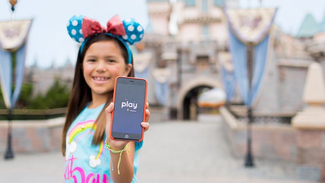 Proudly show your free Play Disney Parks app, with games and activities designed to take the edge off waiting in line.
