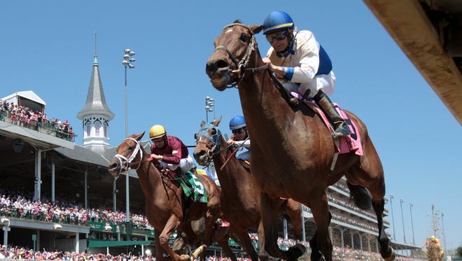 Molly Morgan, with Corey J. Lanerie in the irons, wins the La Troienne.May 1, 2015