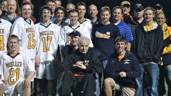Tom Kennedy, surrounded by lacrosse players, family and friends, died in January. The Moeller lacrosse team will honor him May 9.