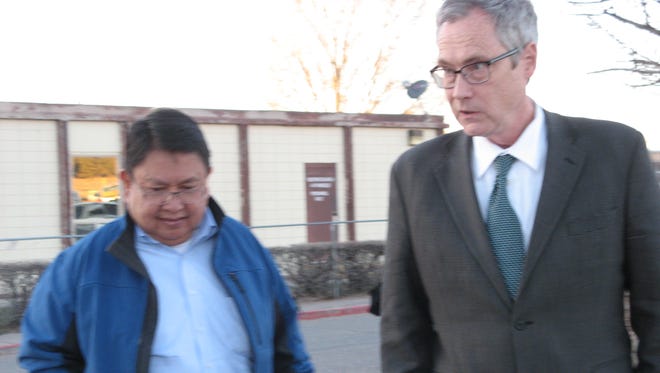 Navajo Nation Council Delegate Mel R. Begay, left, and his attorney, Jeffrey Rasmussen, leave the Window Rock District Court in March after a jury found Begay guilty for misusing a tribal financial assistance program.
