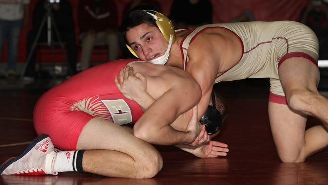 Hillsborough's Jack Donnadio, right, wrestles Edison's Joey Montouro at 138 lbs. at Hillsborough on February 10, 2015. (Photo by Keith A. Muccilli/ Special to NJ Press Media)