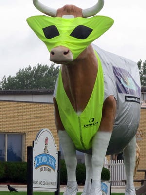 “Bessie” stands decorated in an alien costume on the front lawn at Cedar Crest Ice Cream’s parlor and plant in Manitowoc to promote a previous Sputnikfest.
