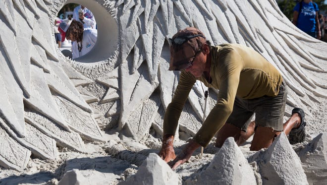 Delays Corbett, right, from Vancouver, Canada and Craig Mutch, from White Rock, Canada work on their master sculptors doubles sculpture on Sunday, November 27, 2016 at the 30th Annual American Sand Sculpting Championship in Fort Myers Beach, Fla. The ten day event ended Sunday with the advanced amateur national and master sculptors doubles competitions. 