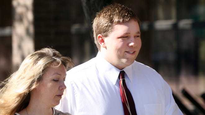 In this April 4, 2011 photo, Roy High School bomb plot suspect Joshua Kyler Hoggan, 16, right, walks out of the 2nd District Juvenile Court in Ogden with his mother, Janice Hoggan. Joshua, now 18, is out of juvenile detention and running for mayor of Roy, Utah.