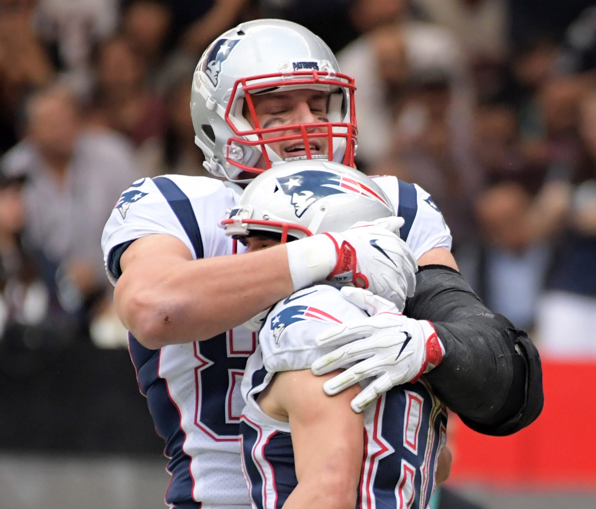 New England Patriots wide receiver Danny Amendola (80) celebrates with tight end Rob Gronkowski (87) after catching a touchdown pass in the second quarter against the Oakland Raiders during an NFL International Series game at Estadio Azteca.