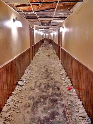 A University of Michigan fraternity is being accused of causing significant damage to 45 rooms, including this hallway.