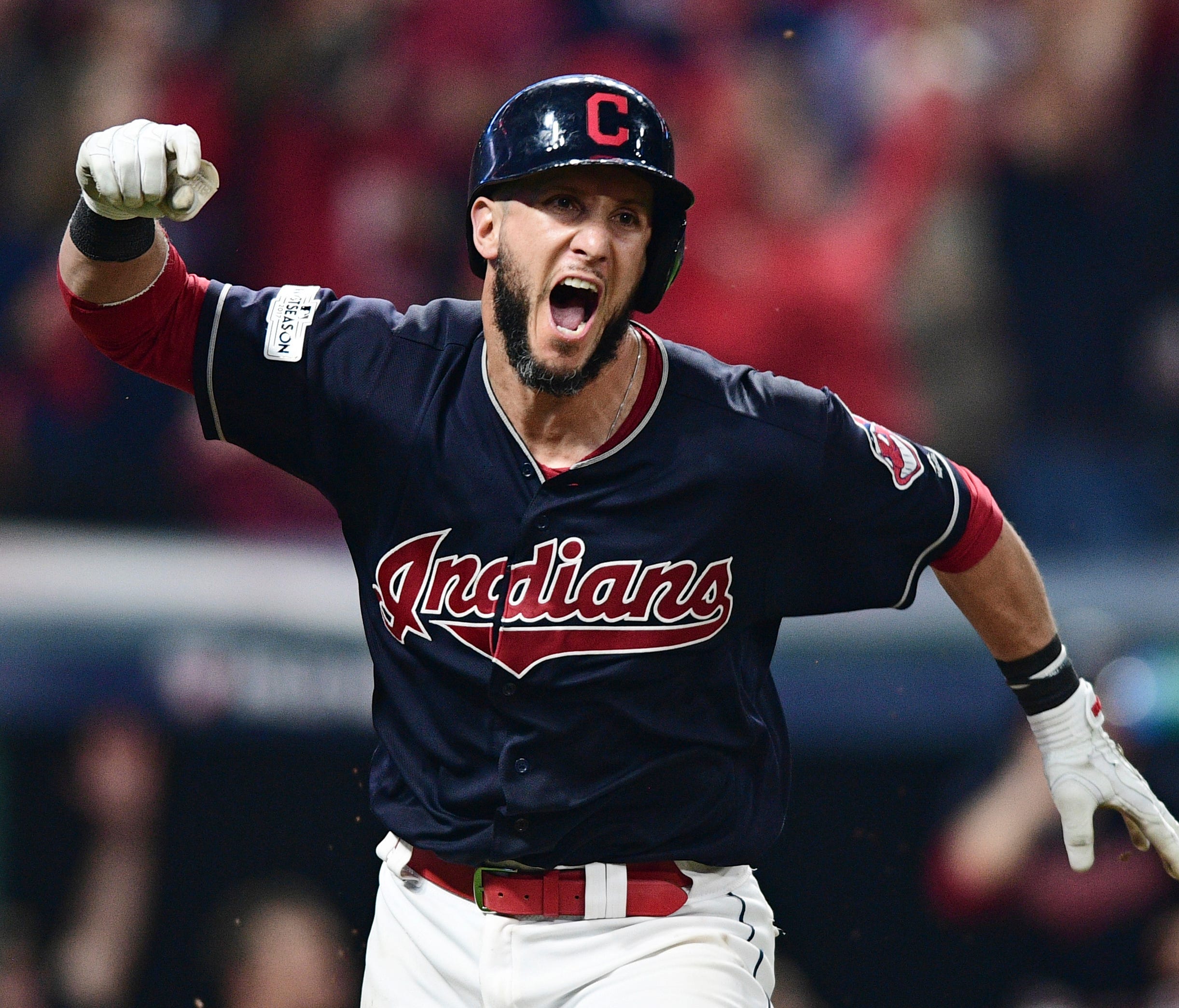 Indians' Yan Gomes celebrates after hitting a game-winning single in the 13th inning.
