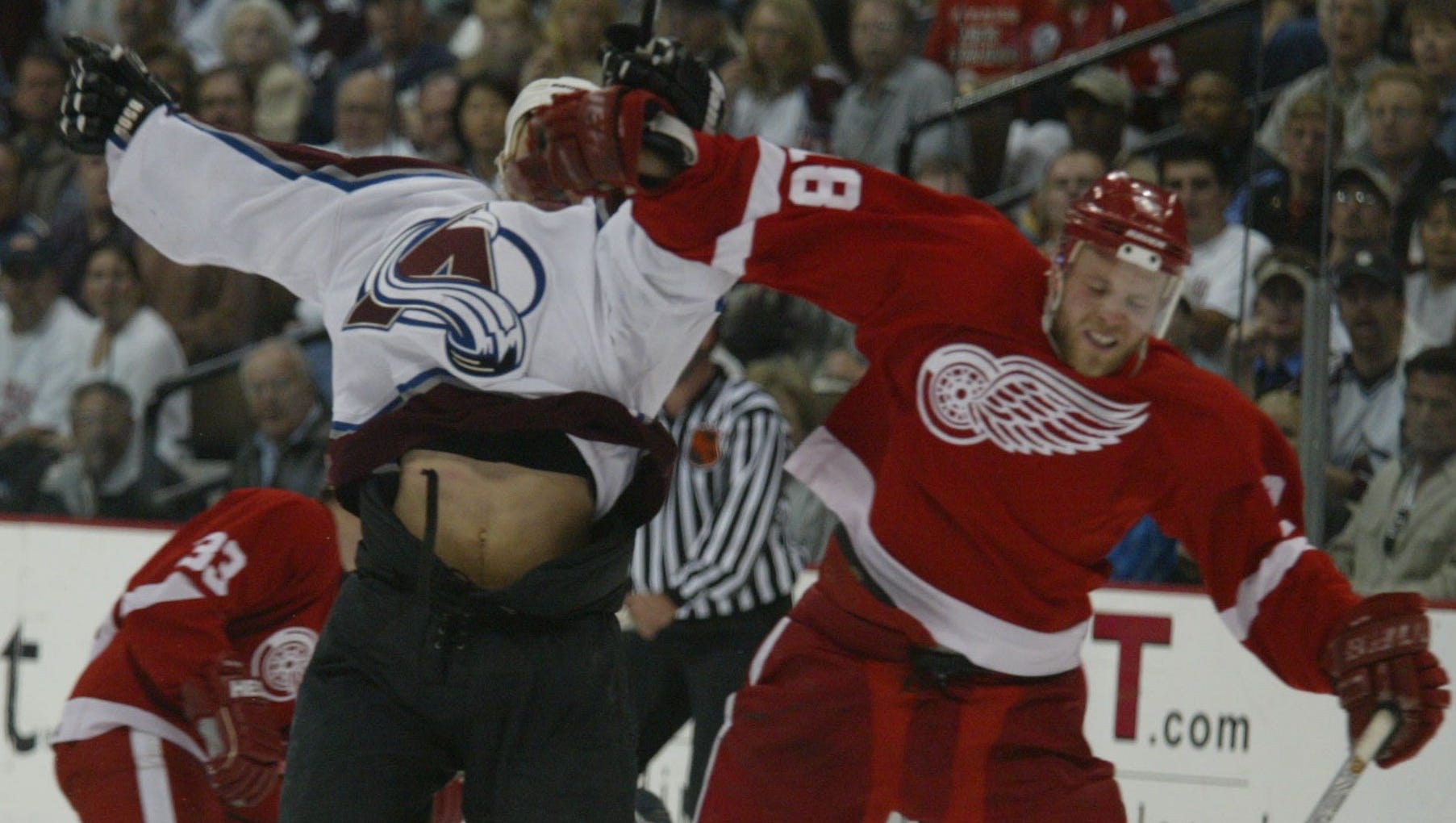 Detroit Red Wings forward Kirk Maltby, right, and Colorado Avalanche forward Dan Hinote collide at the Pepsi Center in Denver on May 22, 2002.