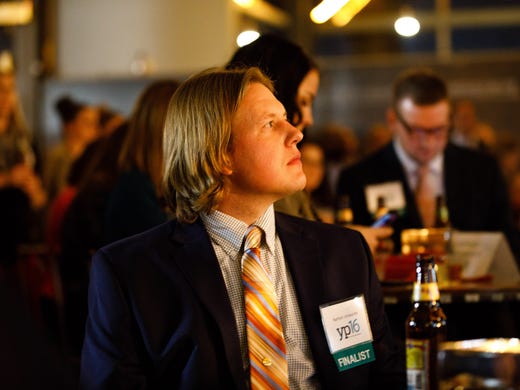 Finalist Nathan Unsworth listens to presenters Thursday,