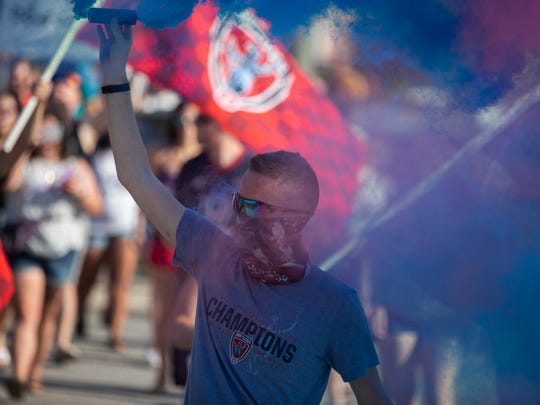 Fans celebrate before an Indy Eleven game.