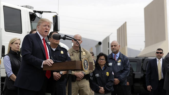 President Donald Trump speaks during a tour as he reviews border wall prototypes, Tuesday, March 13, 2018, in San Diego.
