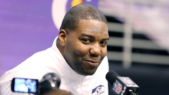 Seattle Seahawks' Russell Okung speaks to the media during the NFL Super Bowl Media Day in Phoenix. Okung is often asked to go at it alone as a left tackle, so it should be no surprise that when it comes to negotiating his next contract he's doing it without an agent. (AP Photo/Gregory Payan, File)