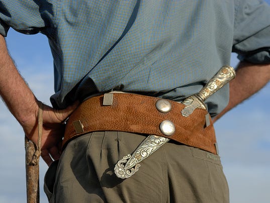 Gaucho, Argentinian cowboy, with silver knife and leather belt