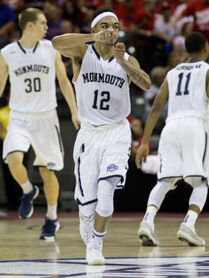 Monmouth guard Justin Robinson (12) celebrates during the second half of an NCAA college basketball game Thursday, Nov. 26, 2015, in Orlando, Fla. Monmouth won 70-68. (AP Photo/Willie J. Allen Jr.)