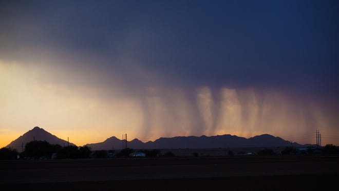 Bands of rain move over Phoenix during a monsoon storm on Aug. 24, 2016.