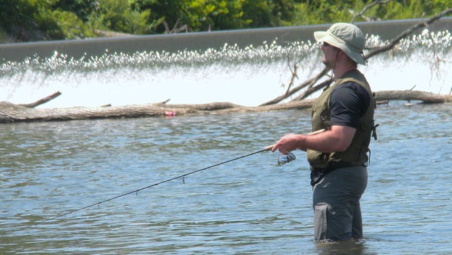The Chemung River dam in downtown Elmira is a popular fishing spot.