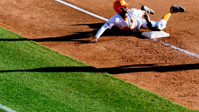 Tennessee outfielder/infielder Jay Charleston (4) slides into third base during a game between Tennessee and ETSU at Lindsey Nelson Stadium in Knoxville, Tennessee on Friday, March 2, 2018.