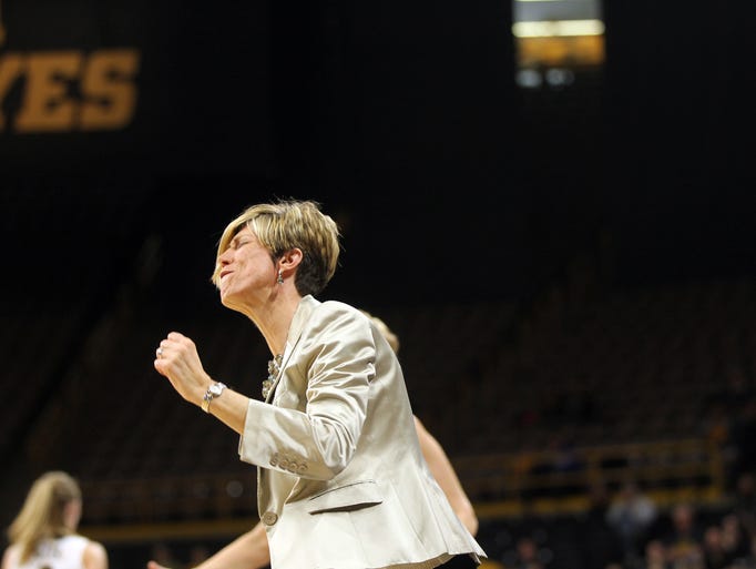 Iowa associate head coach Jan Jensen reacts to a call