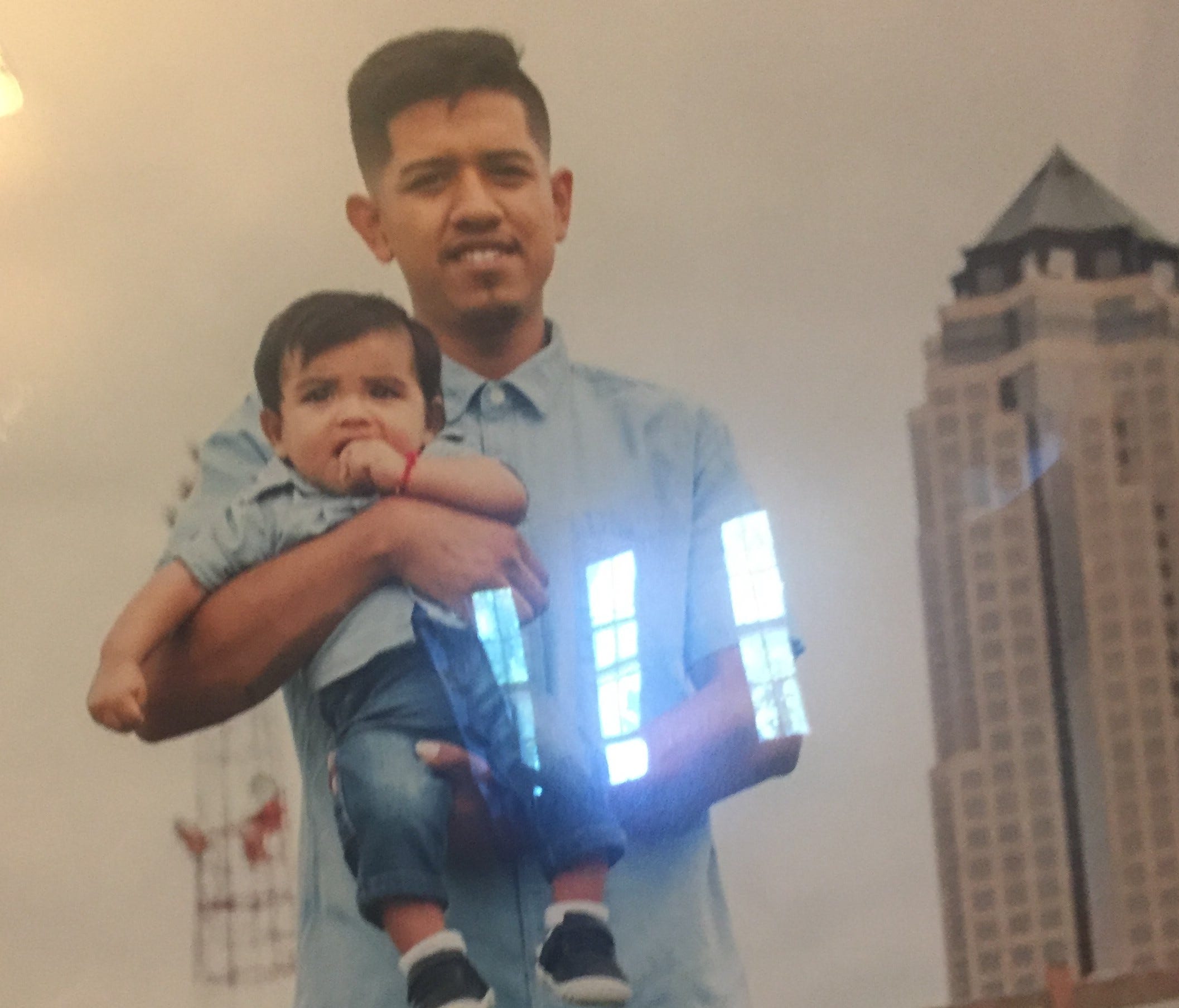 Manuel Cano Pacheco with his baby son in Des Moines. Manuel died last month in Mexico, after being deported.