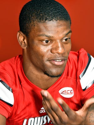 Louisville quarterback Lamar Jackson answers a reporters question during Louisville Football Media Day, Saturday, Aug. 5, 2017 in Louisville Ky.