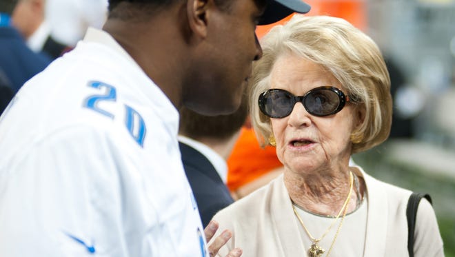 Detroit Lions owner Martha Ford, right, speaks with former player Barry Sanders before a game against the Chicago Bears at Ford Field.