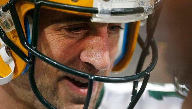 Green Bay Packers quarterback Aaron Rodgers warms up before Sunday's game against the Minnesota Vikings in Minneapolis.