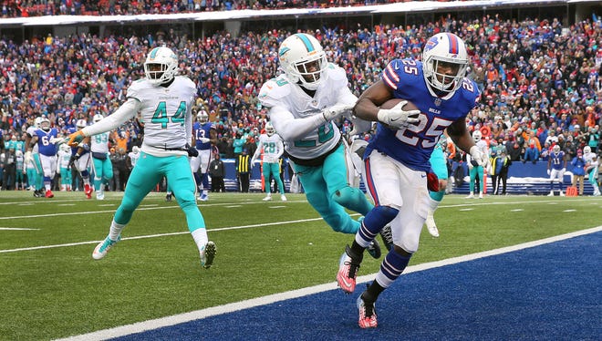Bills running back LeSean McCoy scores on a 16-yard touchdown pass in a 24-16 win over Miami. 