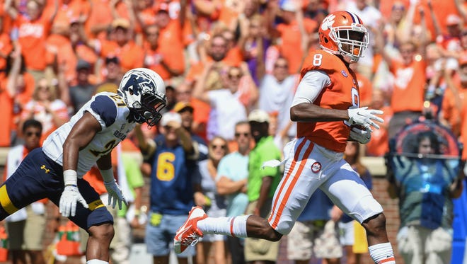 Clemson wide receiver Deon Cain (8) catches a 61 yard TD pass from quarterback Kelly Bryant against Kent Sate during the 1st quarter on Saturday, September 2, 2017 at Clemson's Memorial Stadium.