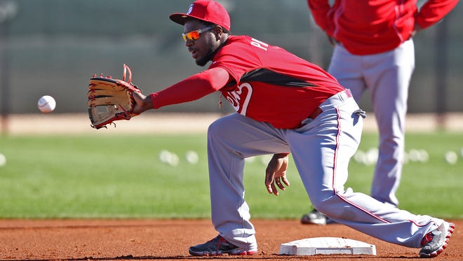 Reds second baseman Brandon Phillips fields a ball during fielding drills in Arizona. Phillips' condition, along with the rest of the Reds' stars, will be watched as spring training continues.