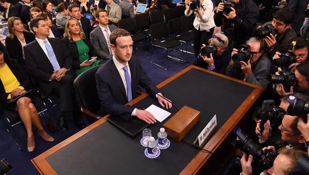 Facebook CEO Mark Zuckerberg arrives to testify...