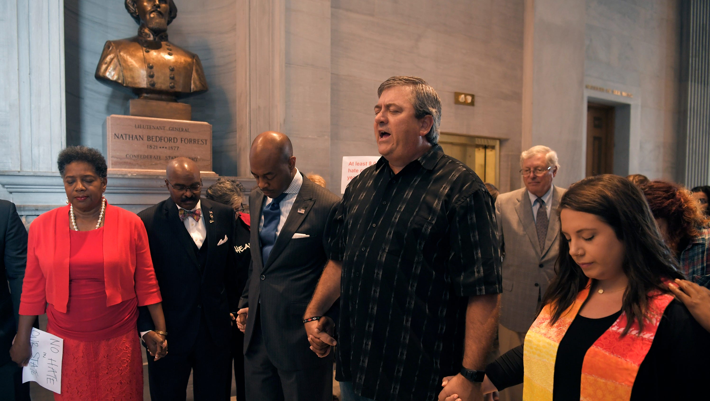 Local clergy, lawmakers and activists pray in front of bust of Nathan Bedford Forrest at the Tennessee Capitol on Monday, August 14, 2017. About 75 activists condemning white supremacy gathered in opposition to the bust of Nathan Bedford Forrest housed there.