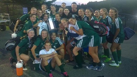 Pleasantville's girls soccer team celebrates winning the 2015 Mount Pleasant Cup after defeating Valhalla 2-1 in overtime at Valhalla High School on Saturday,September 5th, 2015.