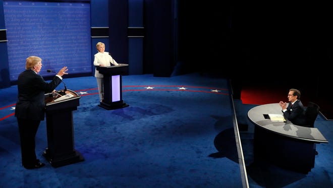 Moderator Chris Wallace, of FOX News, questions Democratic presidential nominee Hillary Clinton and Republican presidential nominee Donald Trump during the third presidential debate at UNLV in Las Vegas, Wednesday, Oct. 19, 2016. (Mark Ralston/Pool via AP)
