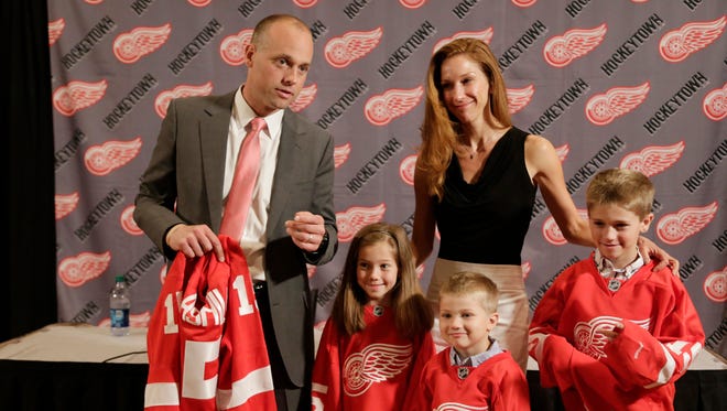 Jeff Blashill stands with his wife Erica, daughter Josie, 7, and sons Teddy, 9, and Owen, 4,
after the Detroit Red Wings introduced him as the new head coach June 9, 2015.