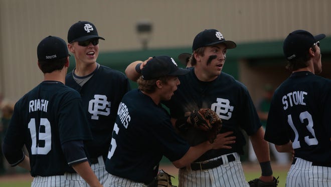 William Norris of Grosse Pointe South celebrates a double-play with Justin McMann (28) against Grosse Pointe North during the 2015 MHSAA Baseball quarterfinals on Tuesday June 9, 2015 at Wayne State University in Detroit.