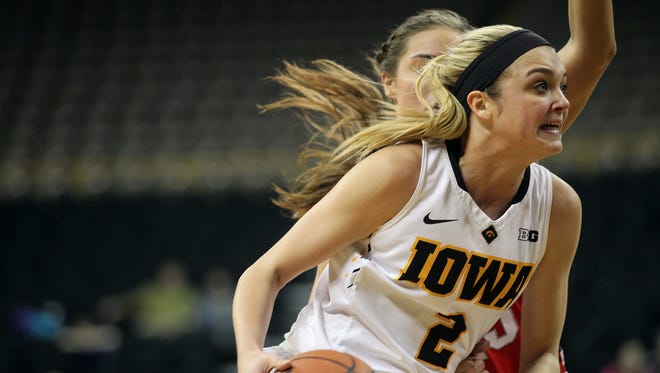 Iowa's Ally Disterhoft drives to the hoop during the Hawkeyes' game against Ohio State at Carver-Hawkeye Arena on Thursday, Feb. 11, 2016.
