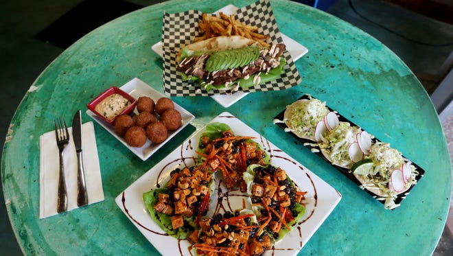 The Bowser BLT, clockwise from top, pork belly tacos, tofu lettuce cups and Grizzlebee tots at Coin Jam in downtown Salem.