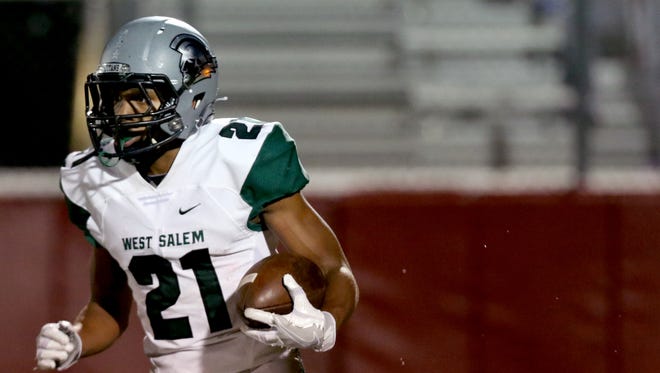 West Salem's Keonte McMurrin (21) rushes with the ball in the second half of the West Salem vs. South Salem football game at South Salem High School on Friday, Oct. 21, 2016. West Salem won the game 45-9.