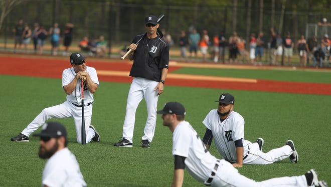 Tigers manager Brad Ausmus watches as pitchers and catchers  warm up on the first day of spring training on Feb. 14 at the remodeled Publix Field at Joker Marchant Stadium in Lakeland, Fla.