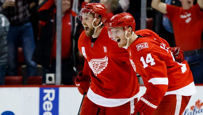 Apr 1, 2017; Detroit, MI, USA; Niklas Kronwall, left, receives congratulations from Gustav Nyquist after scoring in the third period of the Red Wings' 5-4 loss to the Maple Leafs at Joe Louis Arena.